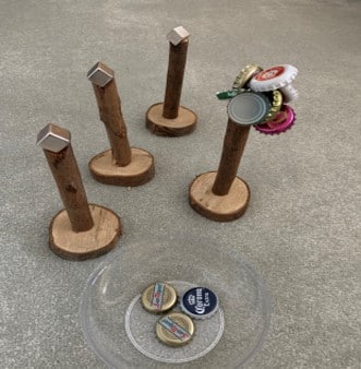 Magnetic bottle tops throwing game