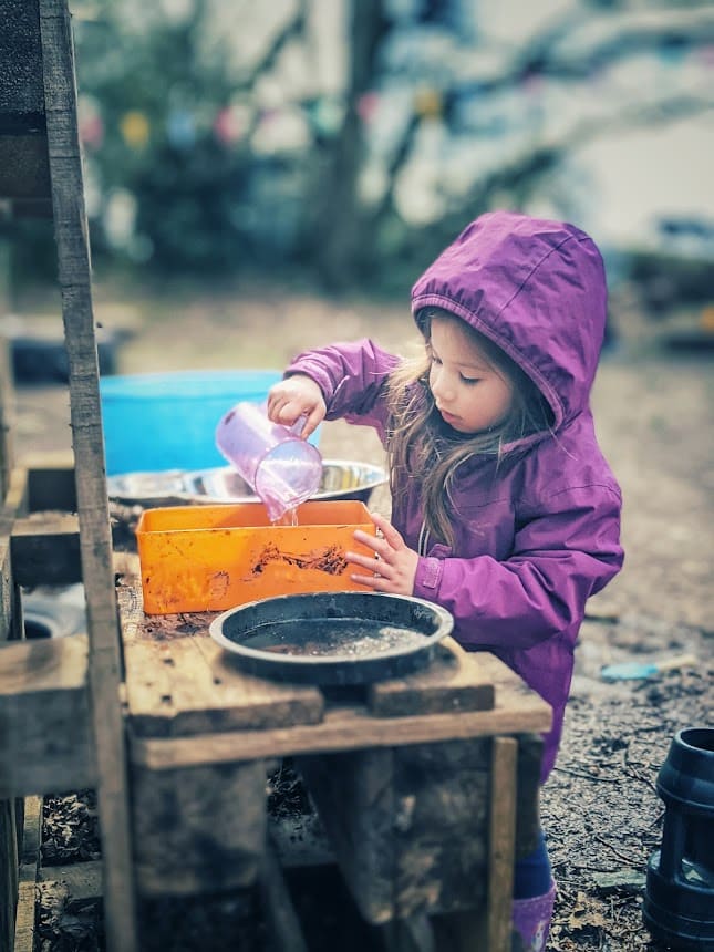 emptying and filling in a mud kitchen